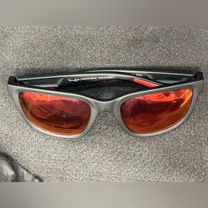 Used Foster Grant Sunglasses Gray and Red Sunglasses with scratches and dents